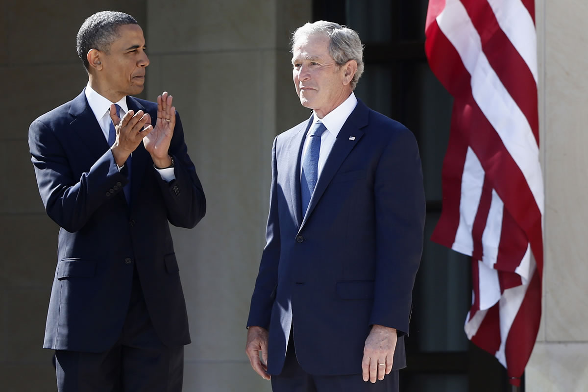 President Barack Obama stands April 25 with former president George W. Bush at the dedication of the George W.