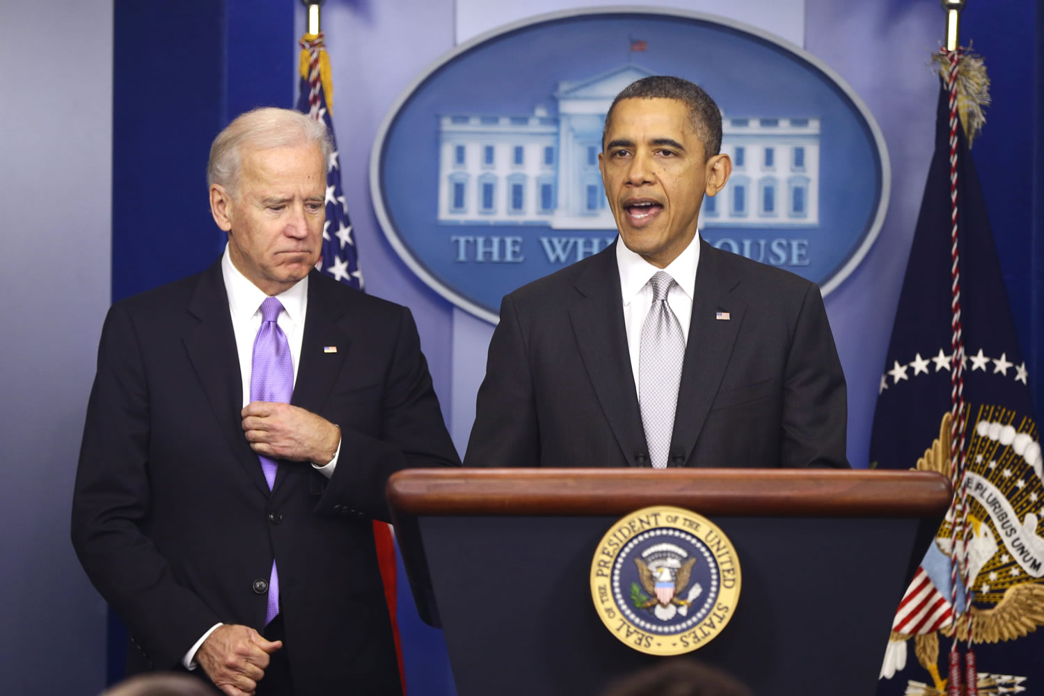 President Barack Obama stands with Vice President Joe Biden as he makes a statement Wednesday in the Brady Press Briefing Room about policies he will pursue following the Newtown, Conn., school shootings.