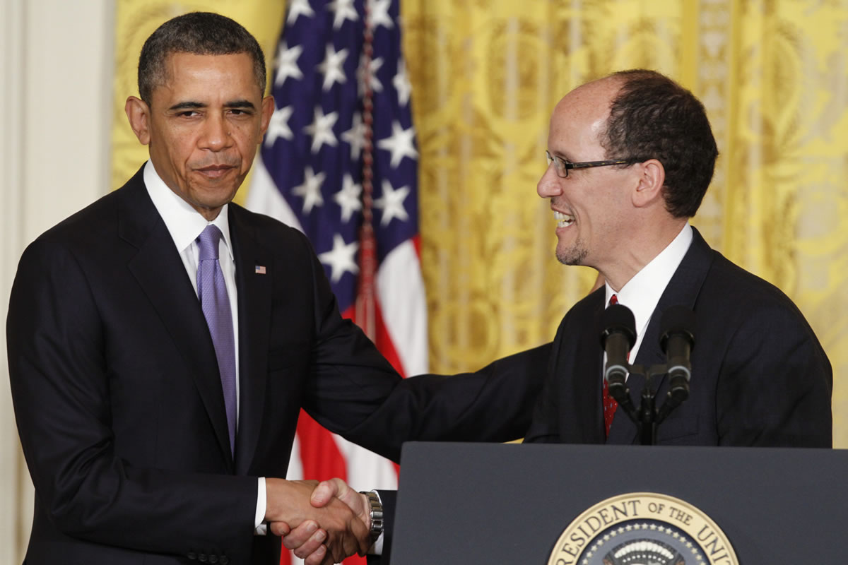 President Barack Obama shakes hands with his nominee for labor secretary, Thomas E.