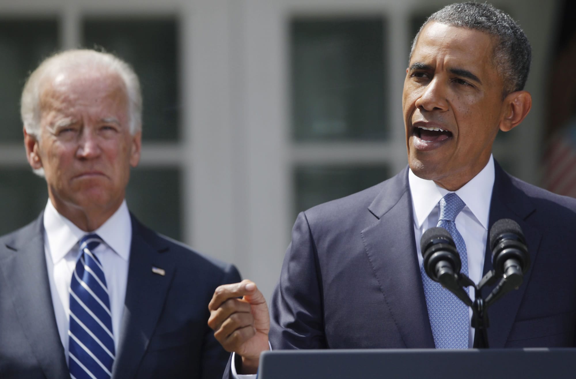 President Barack Obama stands with Vice President Joe Biden, left, as he makes a statement about Syria in the Rose Garden of the White House in Washington on Saturday. Obama says he has decided that the United States should take military action against Syria in response to a deadly chemical weapons attack.