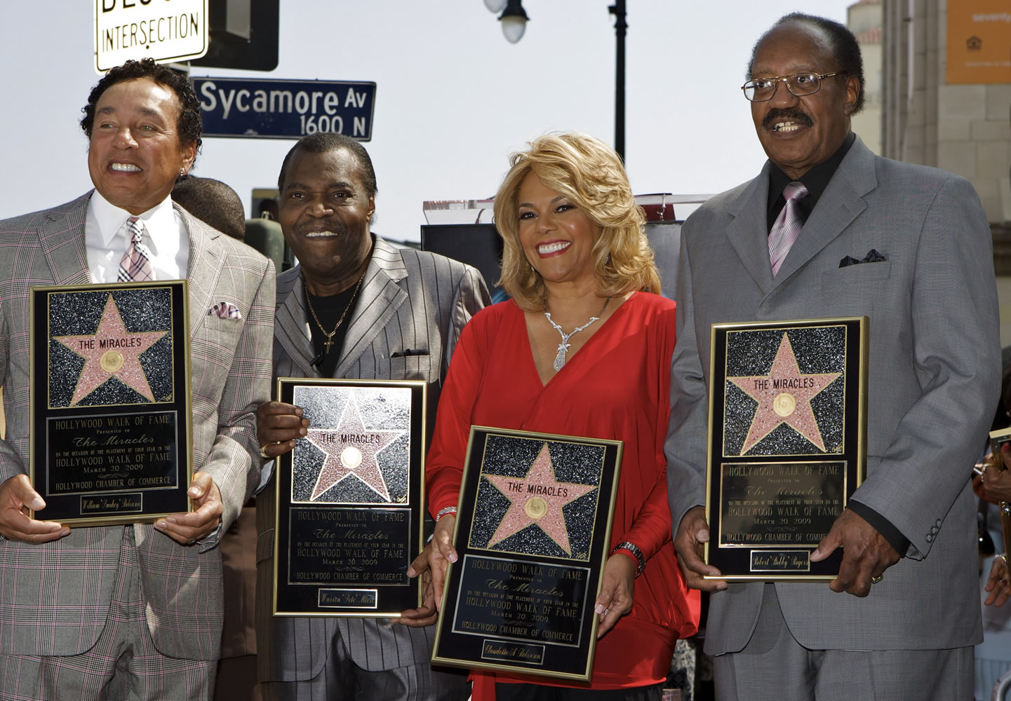 Members of the Motown group The Miracles, from left, William &quot;Smokey&quot; Robinson, Warren &quot;Pete&quot; Moore, Claudette Robinson, and Robert &quot;Bobby&quot; Rogers, are honored with a star on the Hollywood Walk of Fame in Los Angeles in March 2009. Rogers, a founding member of the group and a collaborator with Smokey, has died. Motown Museum board member Allen Rawls said Rogers died Sunday.