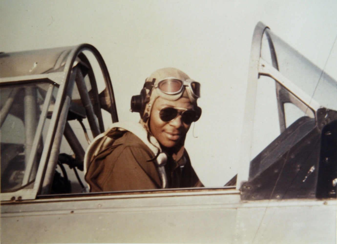 Tuskegee Airman George Hickman sits in the cockpit of an AT-6 trainer airplane in Tuskegee, Ala.