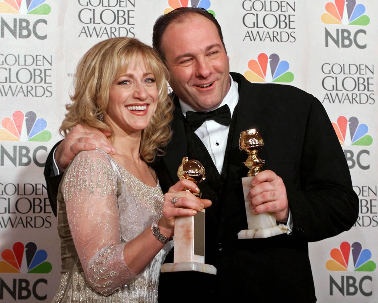 Actors Edie Falco, left, and James Gandolfini with their awards for best performance by an actress and actor in a dramatic televison series for &quot;The Sopranos,&quot; during the 57th Golden Globe Awards in Beverly Hills, Calif., on Jan. 23, 2000. HBO and the managers for Gandolfini say the actor died Wednesday in Italy.