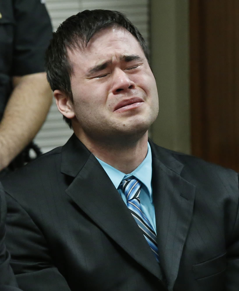 Daniel Holtzclaw cries Thursday as the verdicts are read in his trial in Oklahoma City. Holtzclaw, a former Oklahoma City police officer, was facing dozens of charges alleging he sexually assaulted 13 women while on duty. Holtzclaw was found guilty on a number of counts.