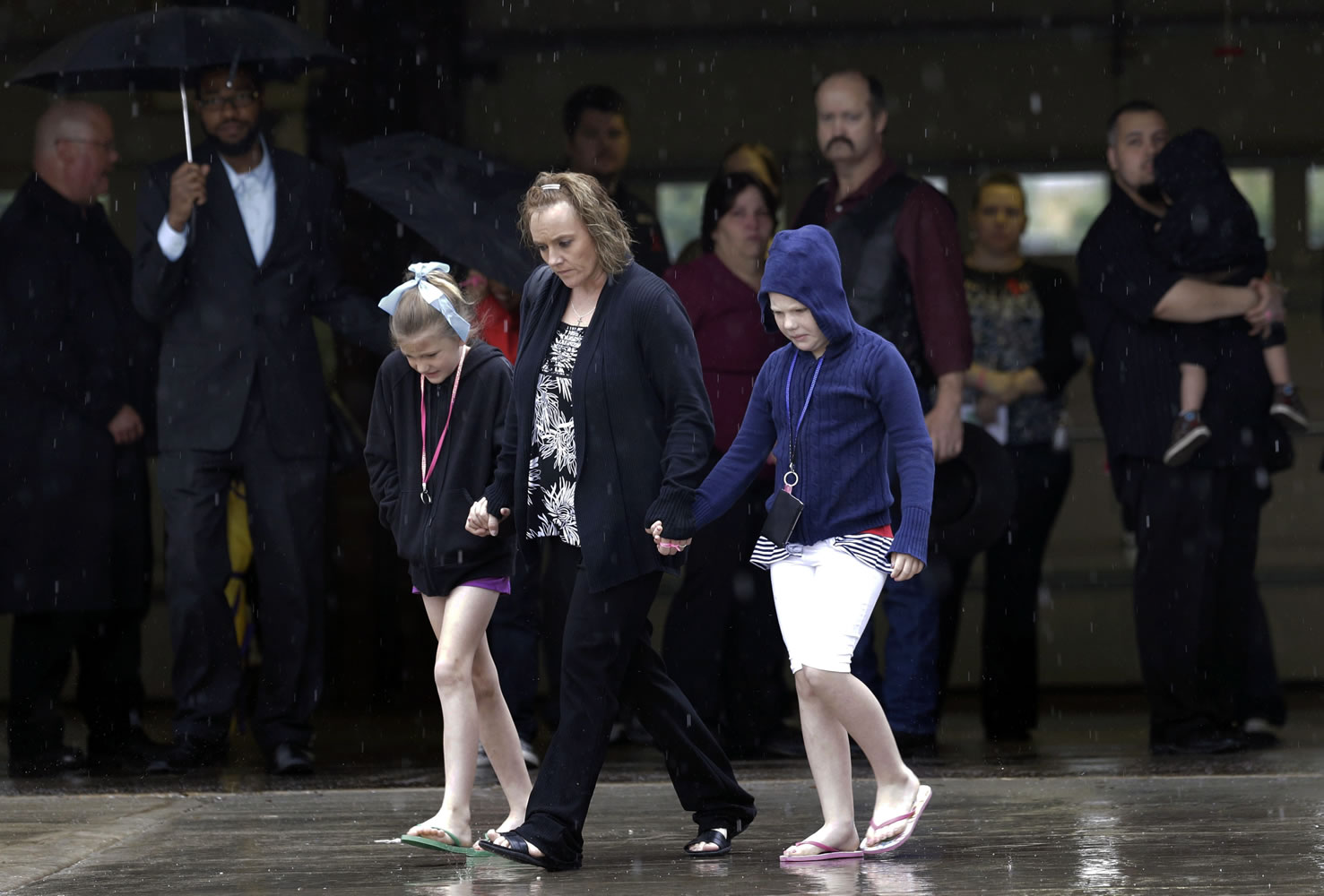 Mourners leave a funeral service for Antonia Calendaria, 9, a student at Towers Plaza Elementary school who was killed by Monday's tornado Thursday in Oklahoma City, Okla.
