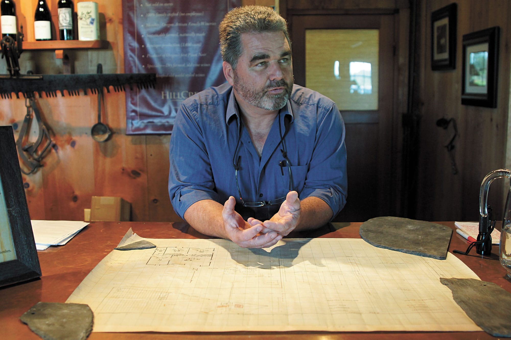 HillCrest Vineyard owner Dyson De Mara leans over a map drawn by Richard Sommer in 1962.