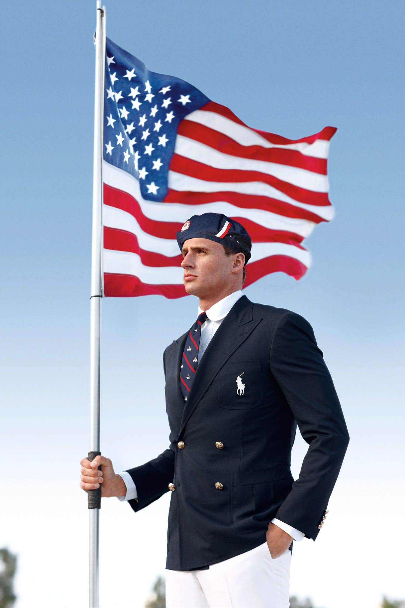This product image released by Ralph Lauren shows U.S. Olympic swimmer Ryan Lochte modeling the the official Team USA Opening Ceremony Parade Uniform. As an official outfitter of the U.S. Olympic and Paralympic Teams, Ralph Lauren has designed Team USAis Official Opening and Closing Ceremony Parade Uniforms as well as a unique collection of village wear apparel and accessories which embodies the spirit of American athleticism and sportsmanship.
