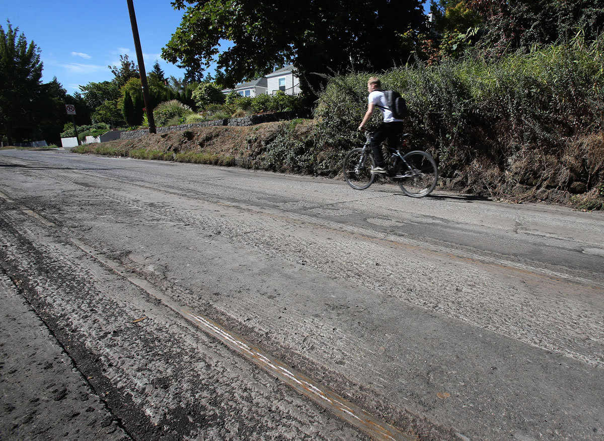 Old trolley tracks get the sun's heat Wednesday after being exposed during the repaving of Willamette Street near the site of the old Civic Stadium in Eugene, Ore.