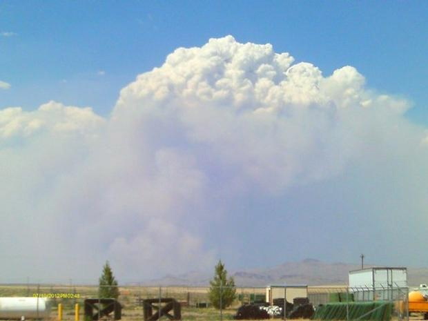 This photo provided by Incident Information System shows a large smoke plume created by the Long Draw wildfire in southeast Oregon.