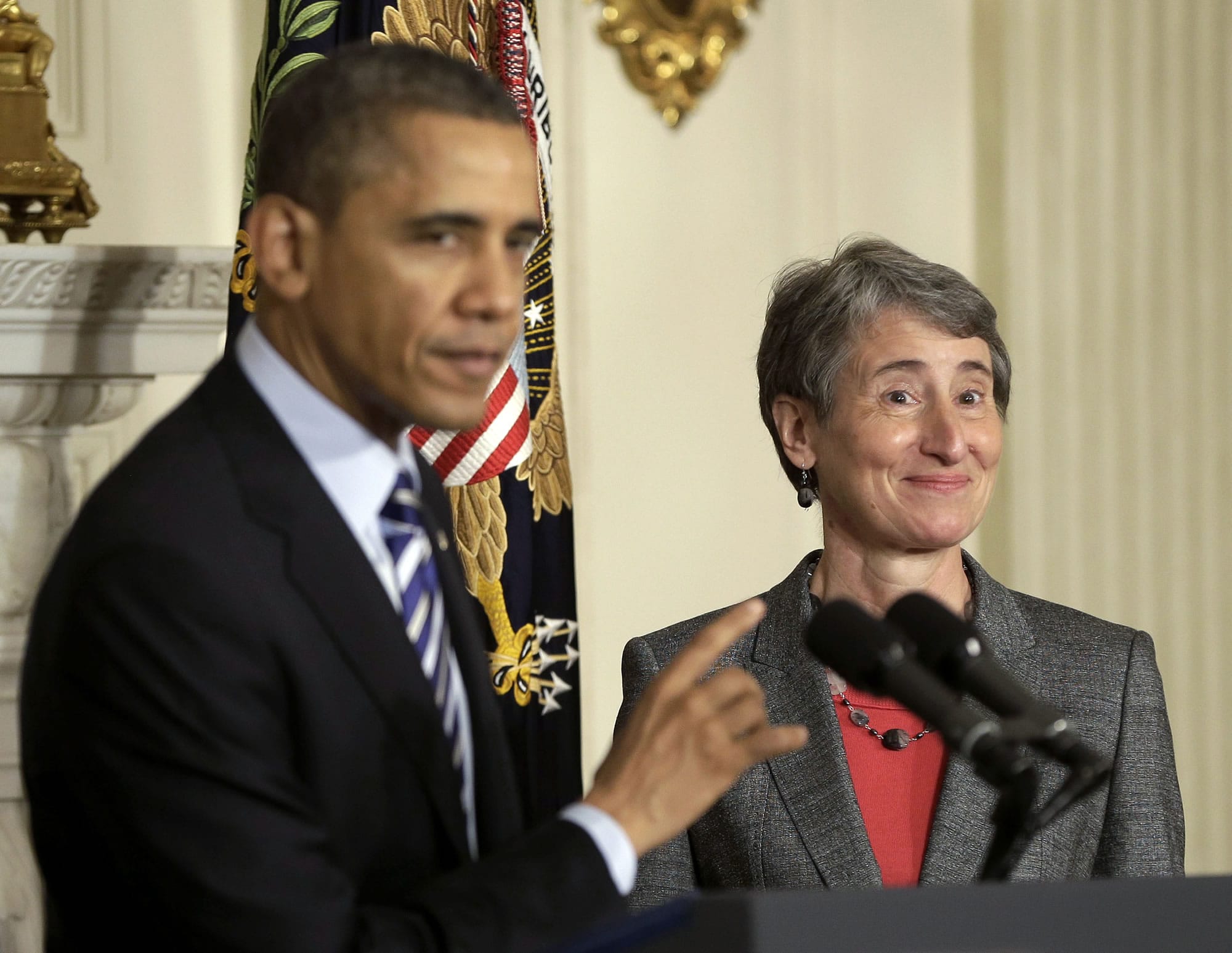 President Barack Obama points towards REI CEO Sally Jewell as he announces that he is nominating her as the next interior secretary replacing outgoing Interior Secretary Ken Salazar,in the State Dining Room of the White House in Washington in February.