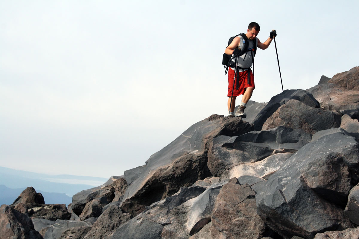 Bryan Zagar of Puyallup navigates the boulders of Monitor Ridge, Mount St. Helens' primary climbing route, on July 31.