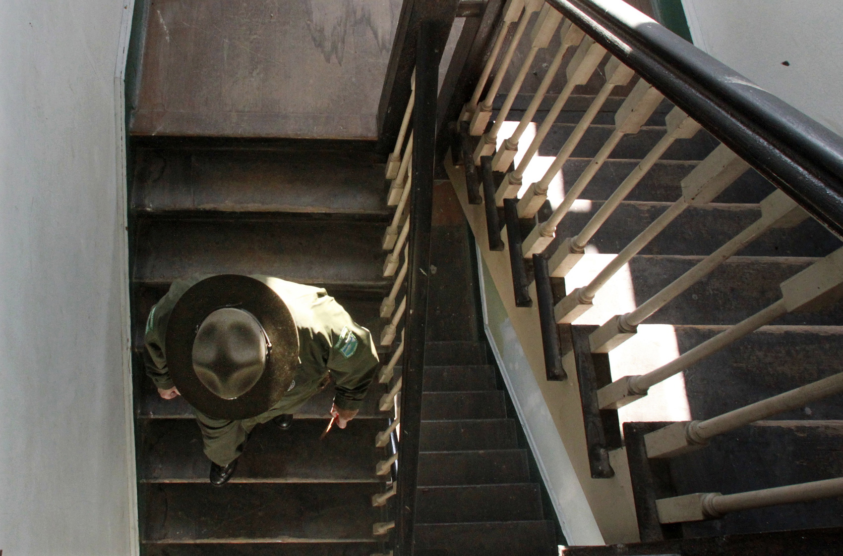 Photos by Alan Berner/The Seattle Times
Park ranger Mike Zimmerman descends a stairway in the old Army hospital at Fort Flagler in Nordland. Restoration of the interior began in 2005 by the Friends of Fort Flagler, and now the first floor with kitchen, ballroom and more is available for events.