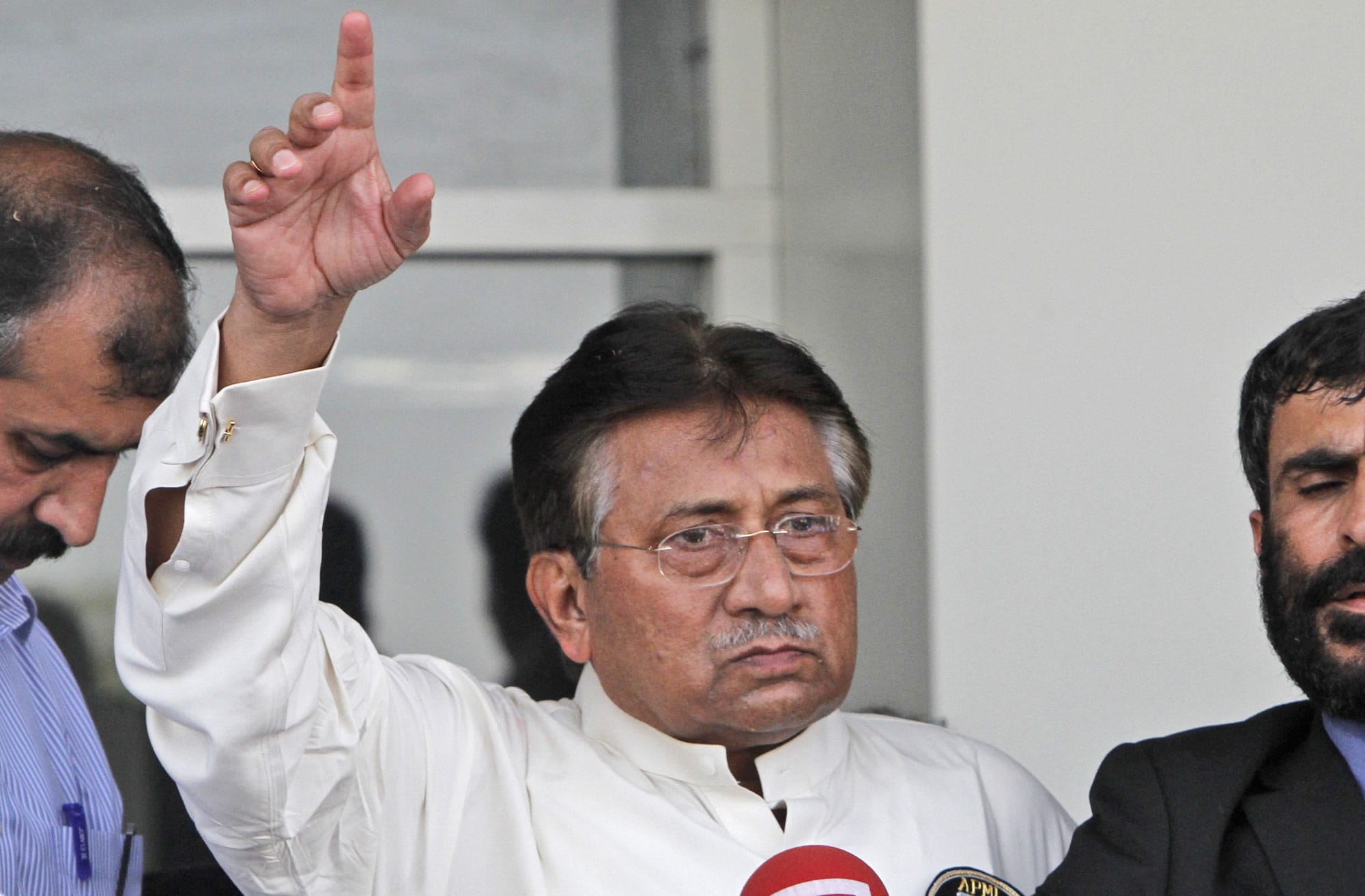 Former Pakistani President Pervez Musharraf, gestures upon his arrival to Karachi airport, Pakistan.