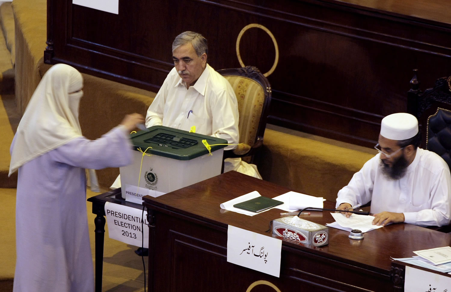 A Pakistani lawmaker casts her vote for the presidential election at the Provincial assembly in Peshawar, Pakistan, on Tuesday.