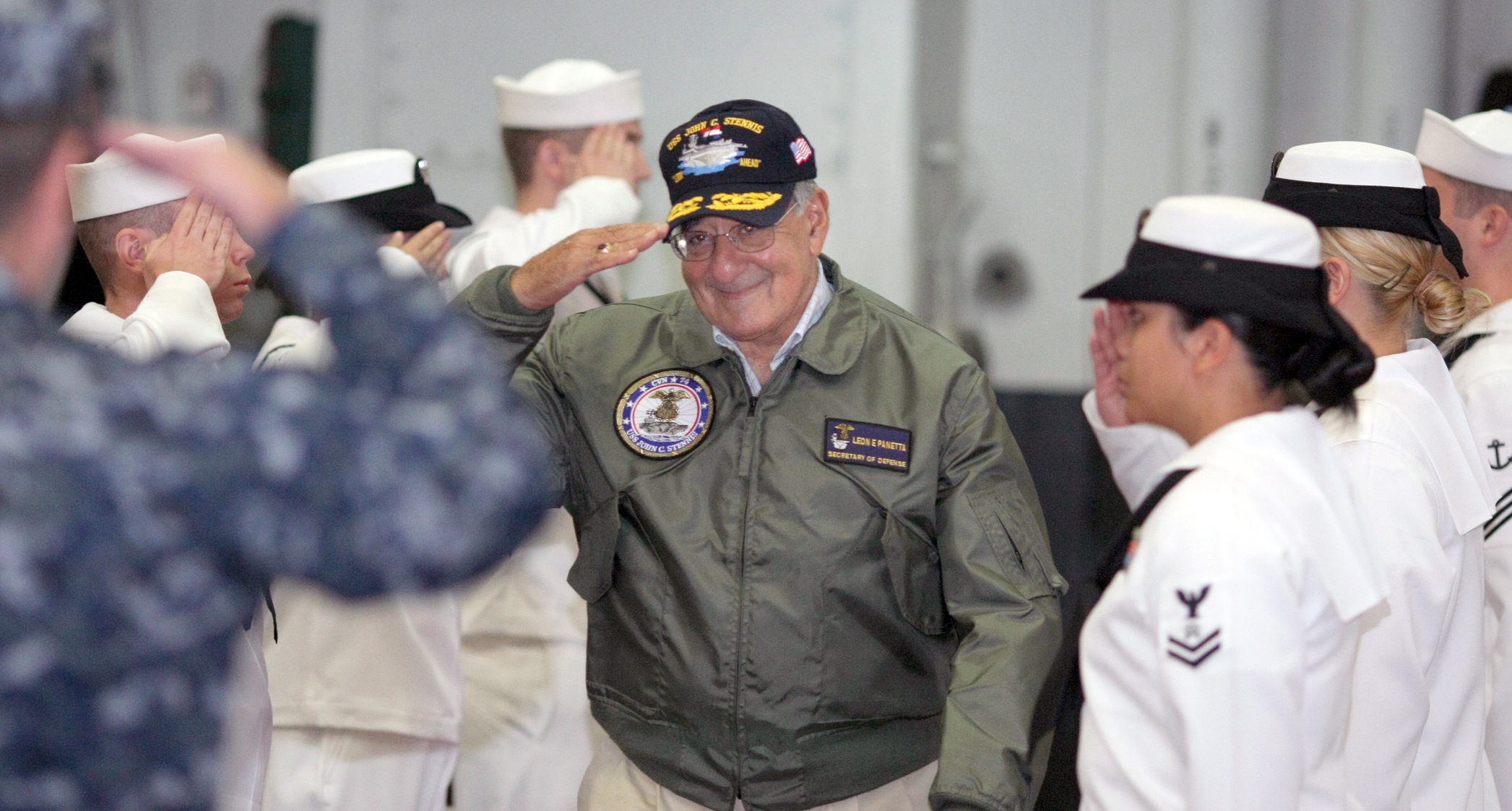 U.S. Secretary of Defense Leon Panetta is welcomed Wednesday in Bremerton as he enters the hangar bay of the USS John C.