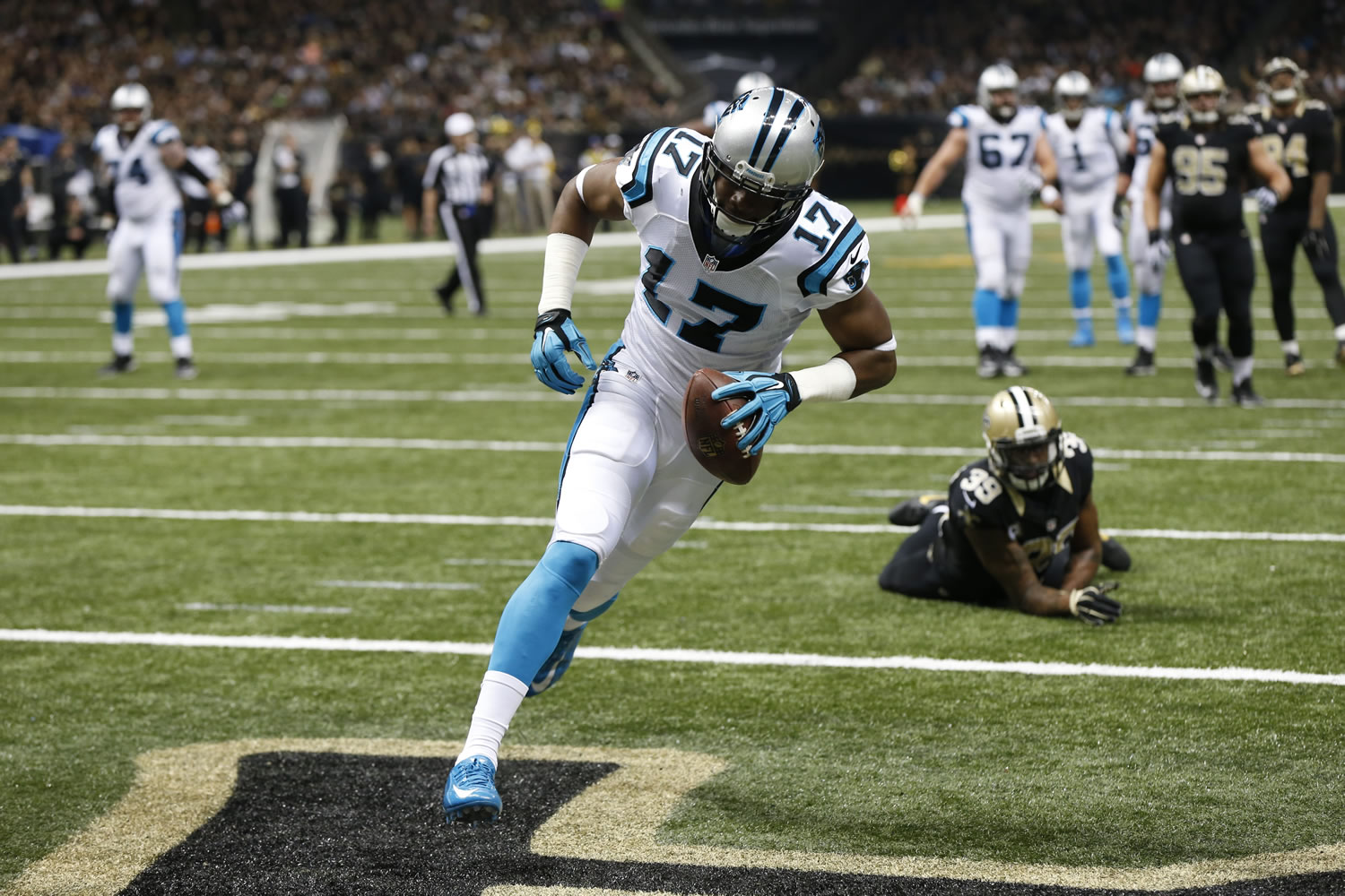 Carolina Panthers wide receiver Devin Funchess (17) touchdown in front of New Orleans Saints cornerback Brandon Browner (39) in the second half of an NFL football game in New Orleans, Sunday, Dec. 6, 2015.