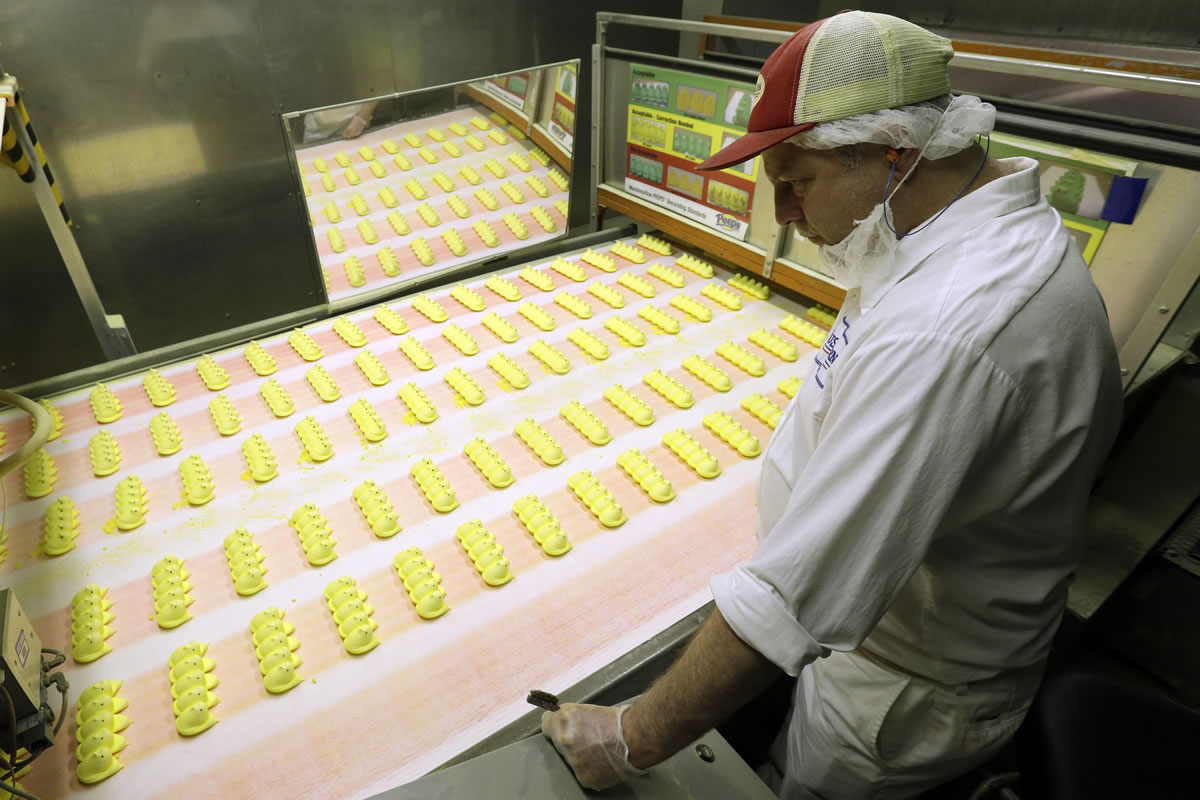 Roger Hildebeitel inspects Peeps as they move through the manufacturing process at the Just Born factory in Bethlehem, Pa.