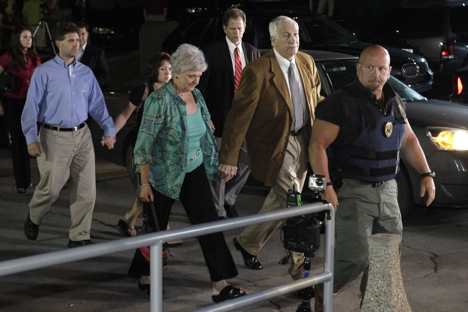 Former Penn State University assistant football coach Jerry Sandusky, right center, arrives with his wife Dottie, left center, at the Centre County Courthouse in Bellefonte, Pa., on Friday..