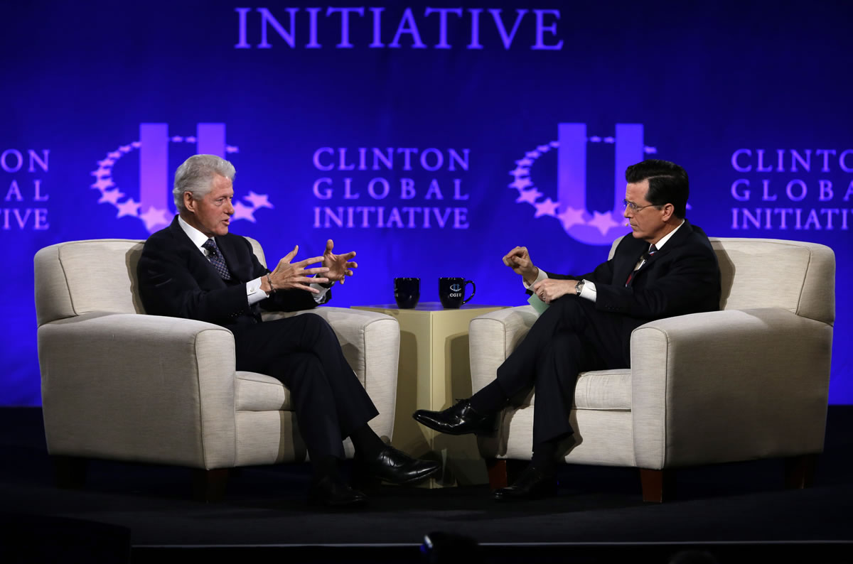 Former President Bill Clinton, left, and Comedy Central's Stephen Colbert during the Clinton Global Initiative at Washington University in St.