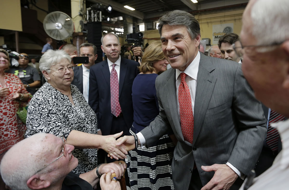 Eric Gay/Associated Press
Texas Gov. Rick Perry greets supporters Monday in San Antonio after announcing he will not seek re-election. A staunch Christian conservative and proven job creator, Perry has been in office nearly 13 years, making him the nation's longest-sitting current governor.