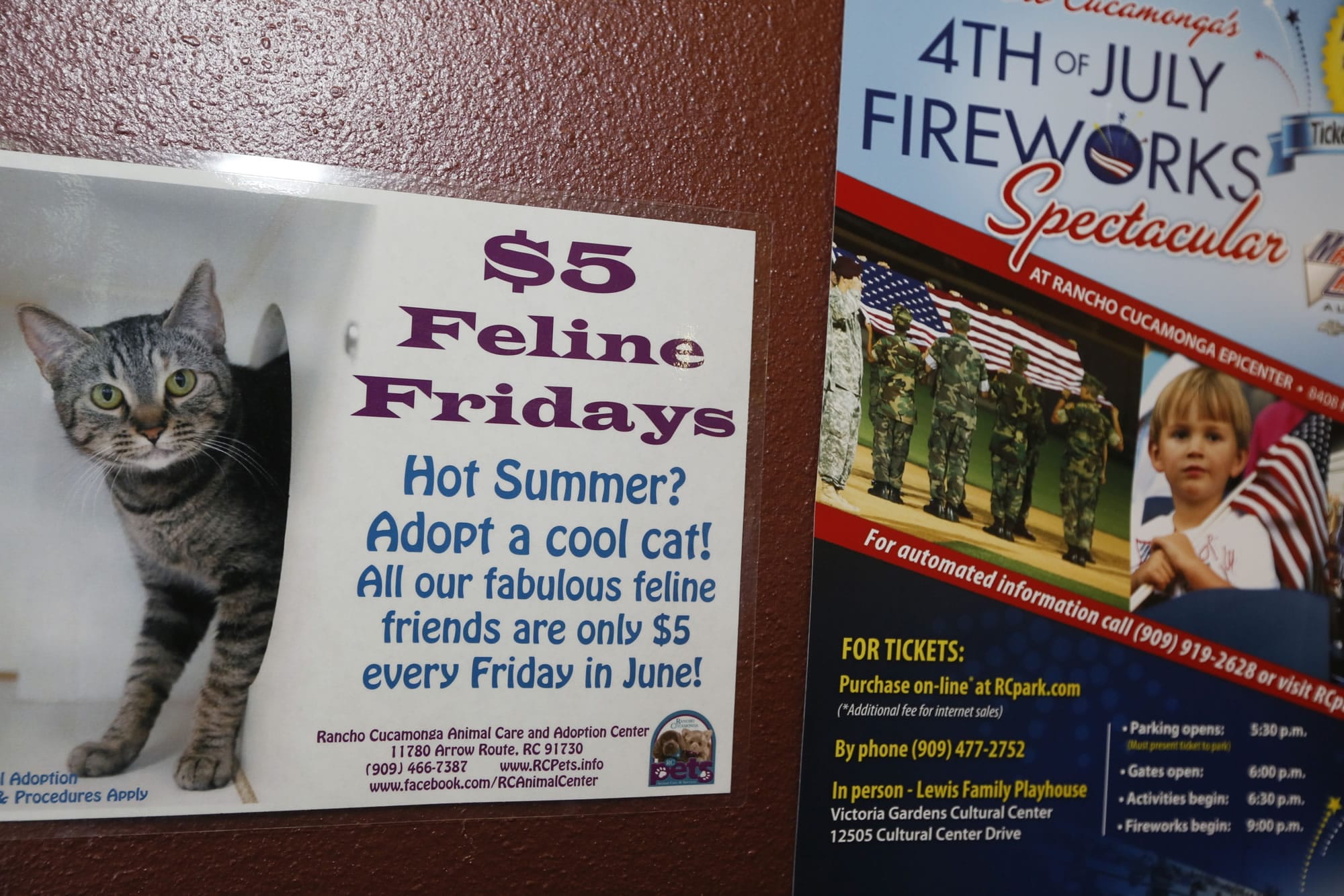 A summer adoption banner is seen next to a 4th of July fireworks events at City of Rancho Cucamonga Animal Care &amp; Adoption Center in Rancho Cucamonga, Calif.
