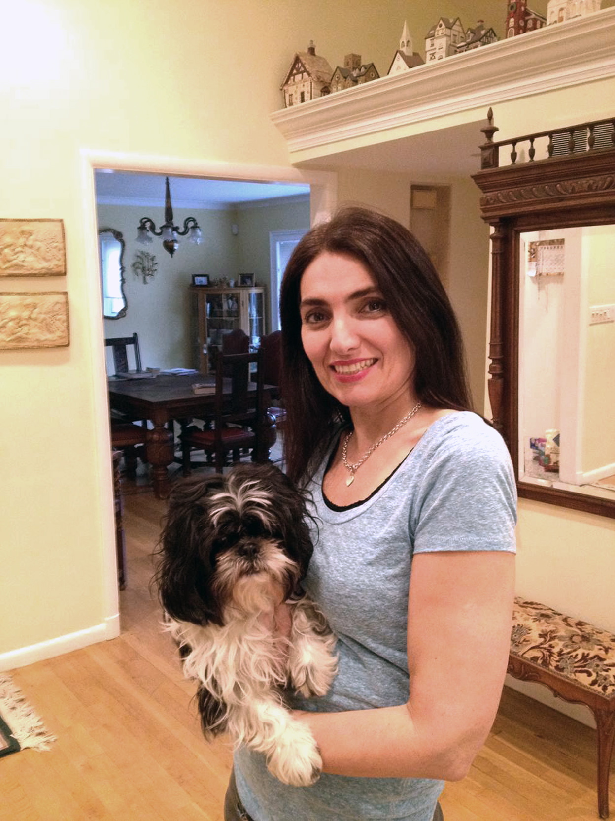 Nancy Guberti, with her dog Flower, is a nutritionist and healthy lifestyle coach so her family, including Flower, has gone green. It was out of necessity, Guberti said. Her youngest son developed a liver disorder and has many allergies.