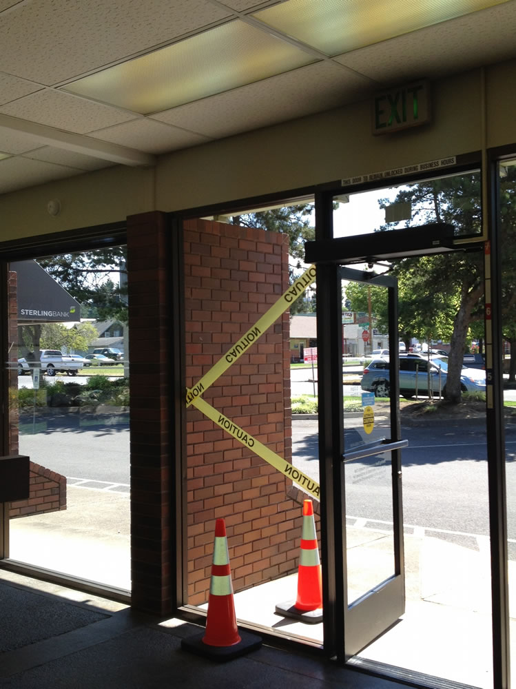 A woman received multiple cuts after walking through the glass window at a Ridgefield bank.