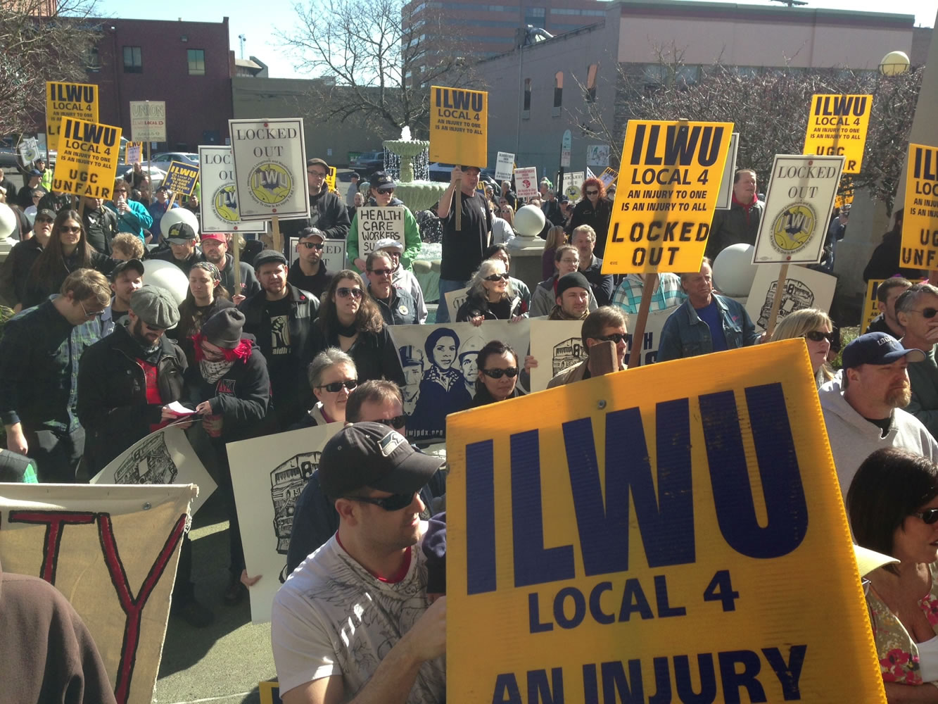 ILWU supporters converge on the downtown office of United Grain this morning.