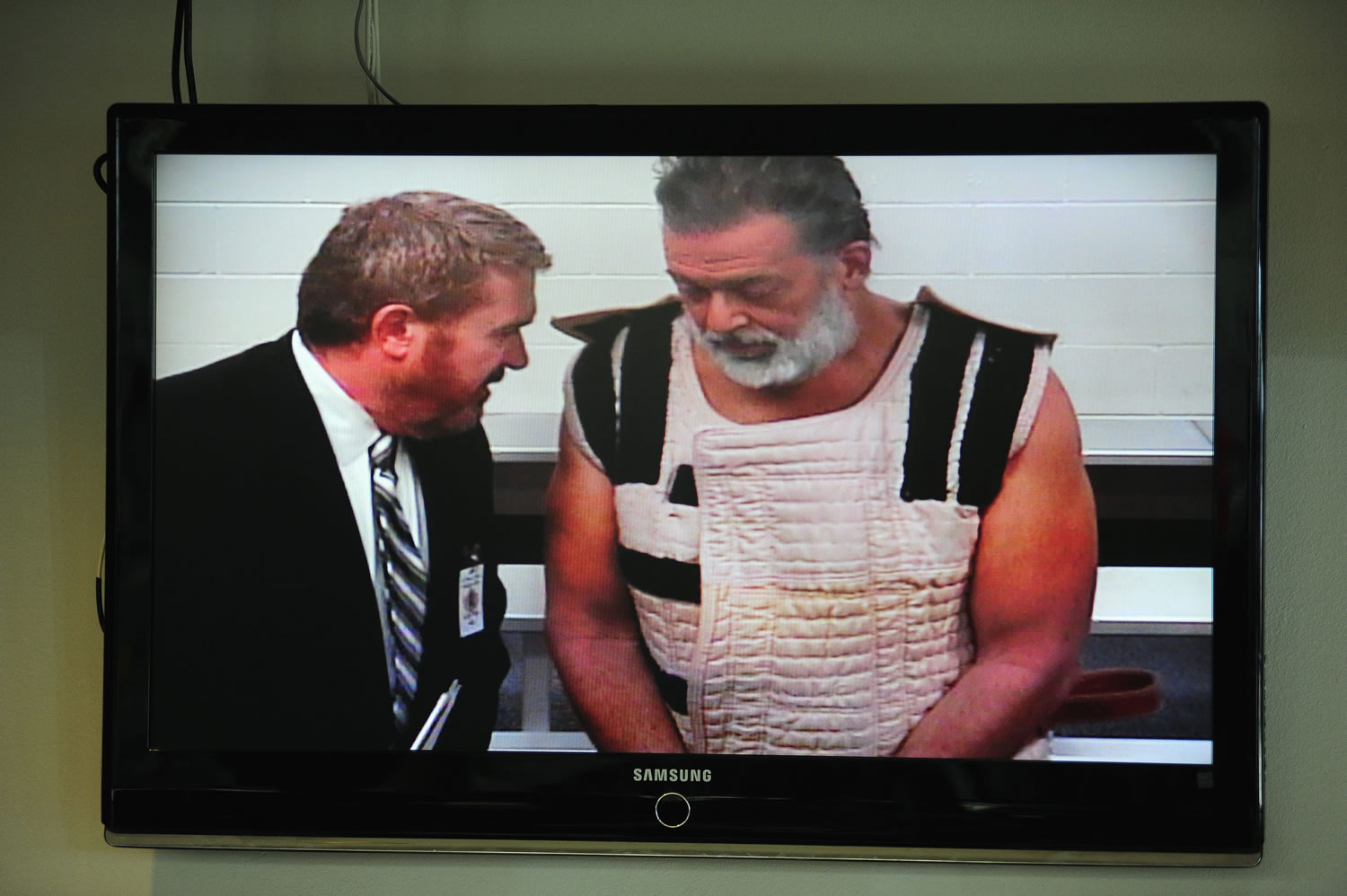 Robert Dear, the suspect in a shooting at a Planned Parenthood clinic in Colorado Springs, Colo., right, appears via video Nov. 30 before Judge Gilbert Martinez, with public defender Dan King, at the El Paso County Criminal Justice Center for his first court appearance.