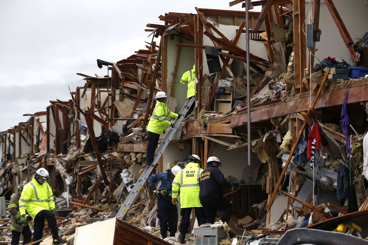 Firefighters conduct search and rescue of an apartment destroyed by an explosion at a fertilizer plant in West, Texas, on Thursday.