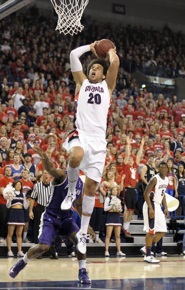 Gonzaga's Elias Harris (20) goes up for the dunk against Portland on Saturday.