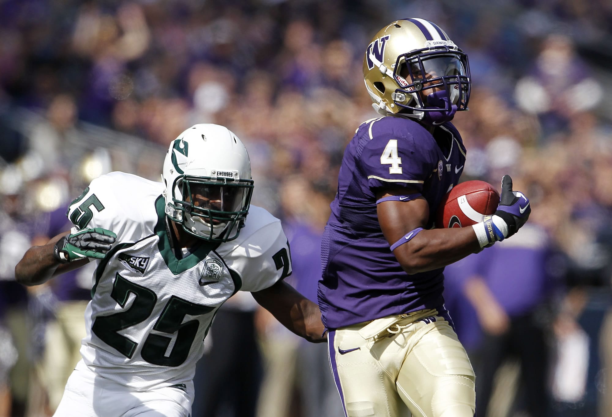 Portland State's Michael Williams (25) gives chase as Washington's Jaydon Mickens runs after a pass reception in the first half of an NCAA football game on Saturday, Sept. 15, 2012, in Seattle.