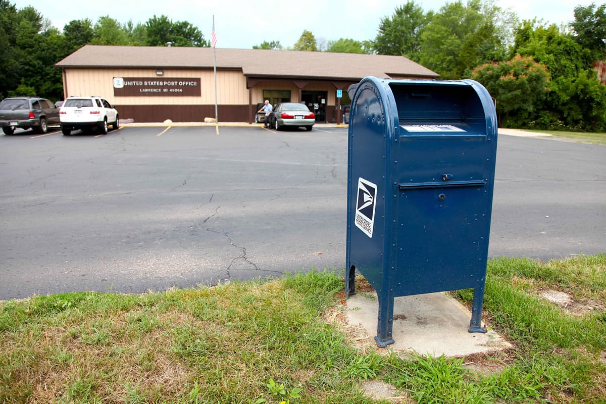 A mailbox sits outside a U.S. Post Office in Lawrence, Mich.  The U.S.