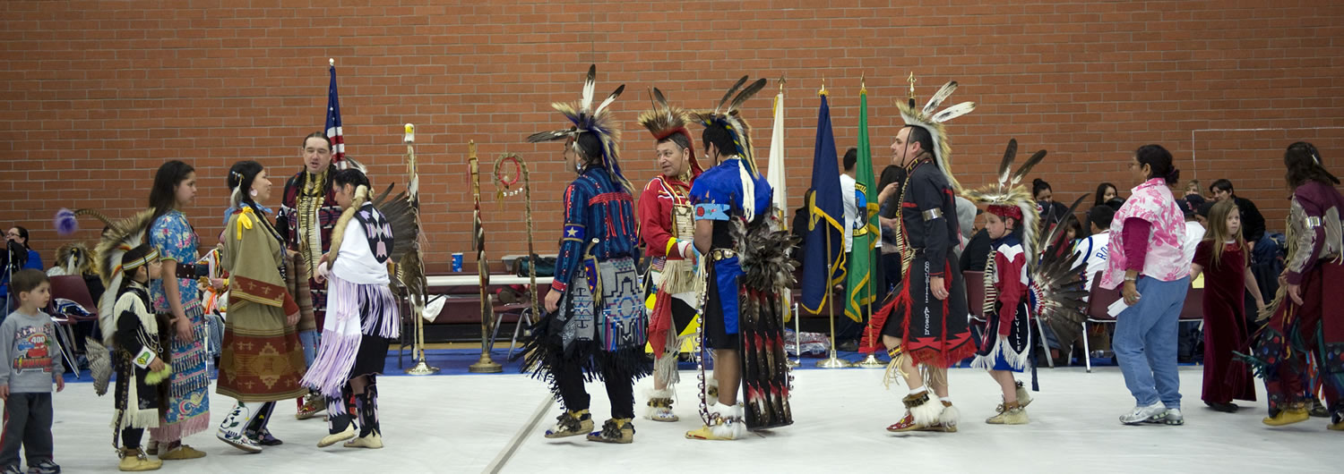 Native American dancers greet each other at the Traditional pow-wow at Covington Middle School.