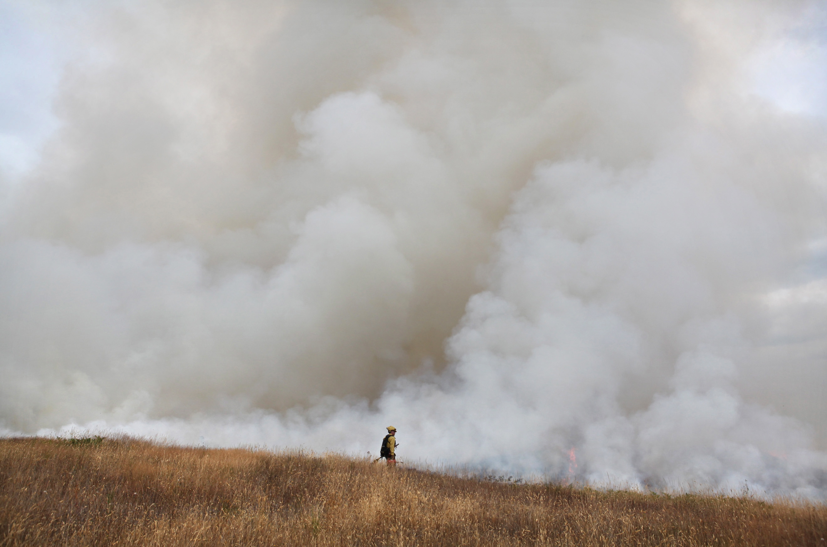 Smoke rises Wednesday from the controlled burn of 60 acres on the Glacial Heritage Preserve southwest of Littlerock.