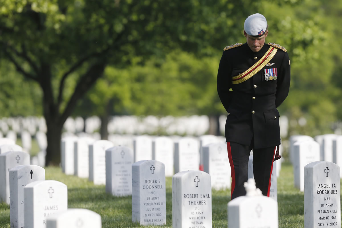 England's Prince Harry visits Section 60 at Arlington National Cemetery on Friday. The British soldier-prince is spending most of his week in the U.S.