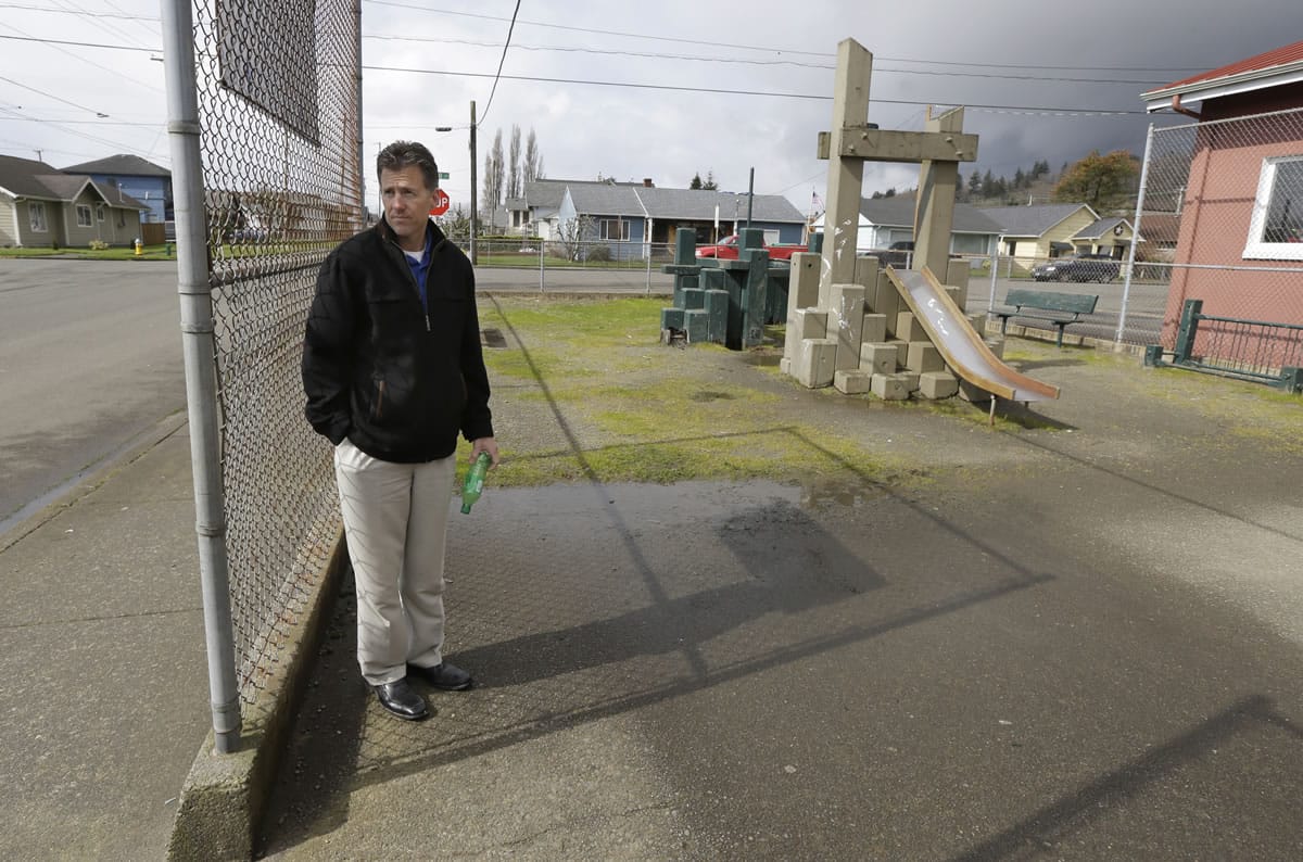 Brian Shay, city administrator of Hoquiam, stands next to a run-down playground that is next to an old fire station that the city plans to replace.