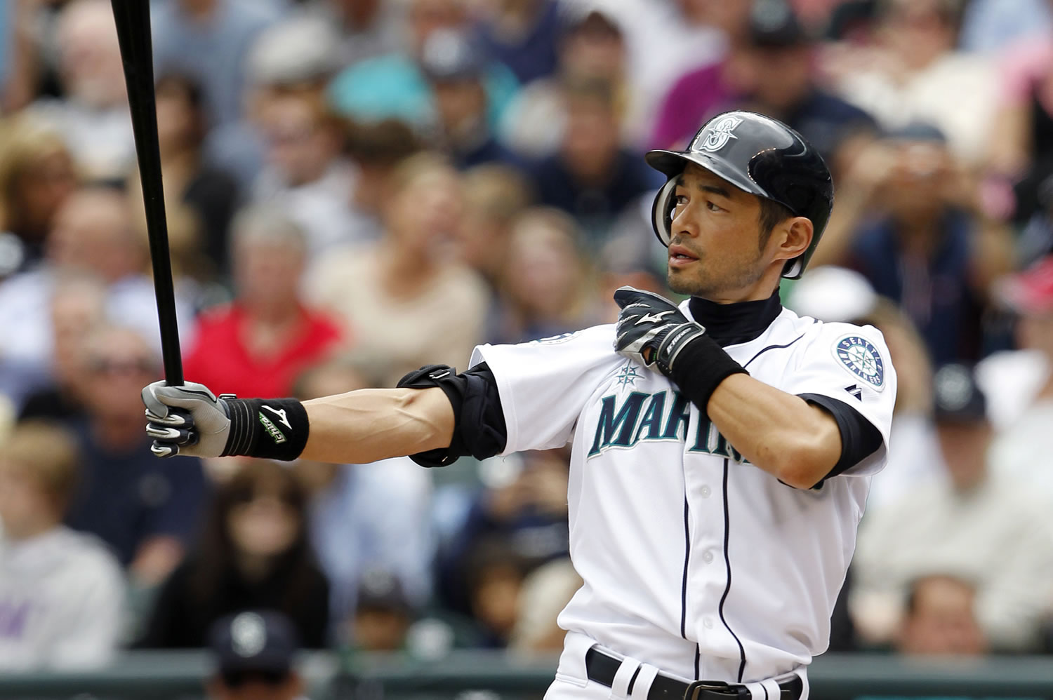 Seattle Mariners all-star outfielder Ichiro Suzuki was traded Monday to the New York Yankees for two minor-league prospects and cash considerations.