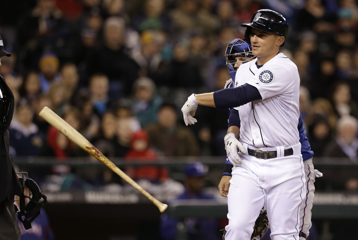 Seattle Mariners' Kyle Seager throws his bat aside after striking out against the Texas Rangers to end the fourth inning Saturday.