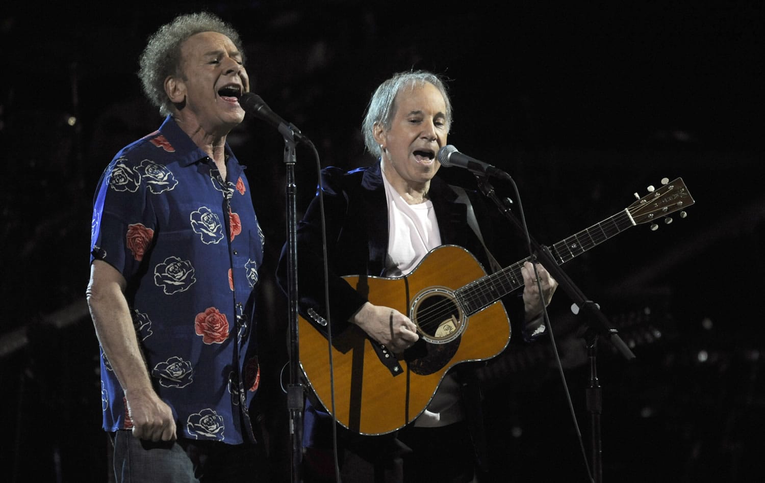 Paul Simon, right, and Art Garfunkel perform at the 25th Anniversary Rock &amp; Roll Hall of Fame concert at Madison Square Garden in New York.