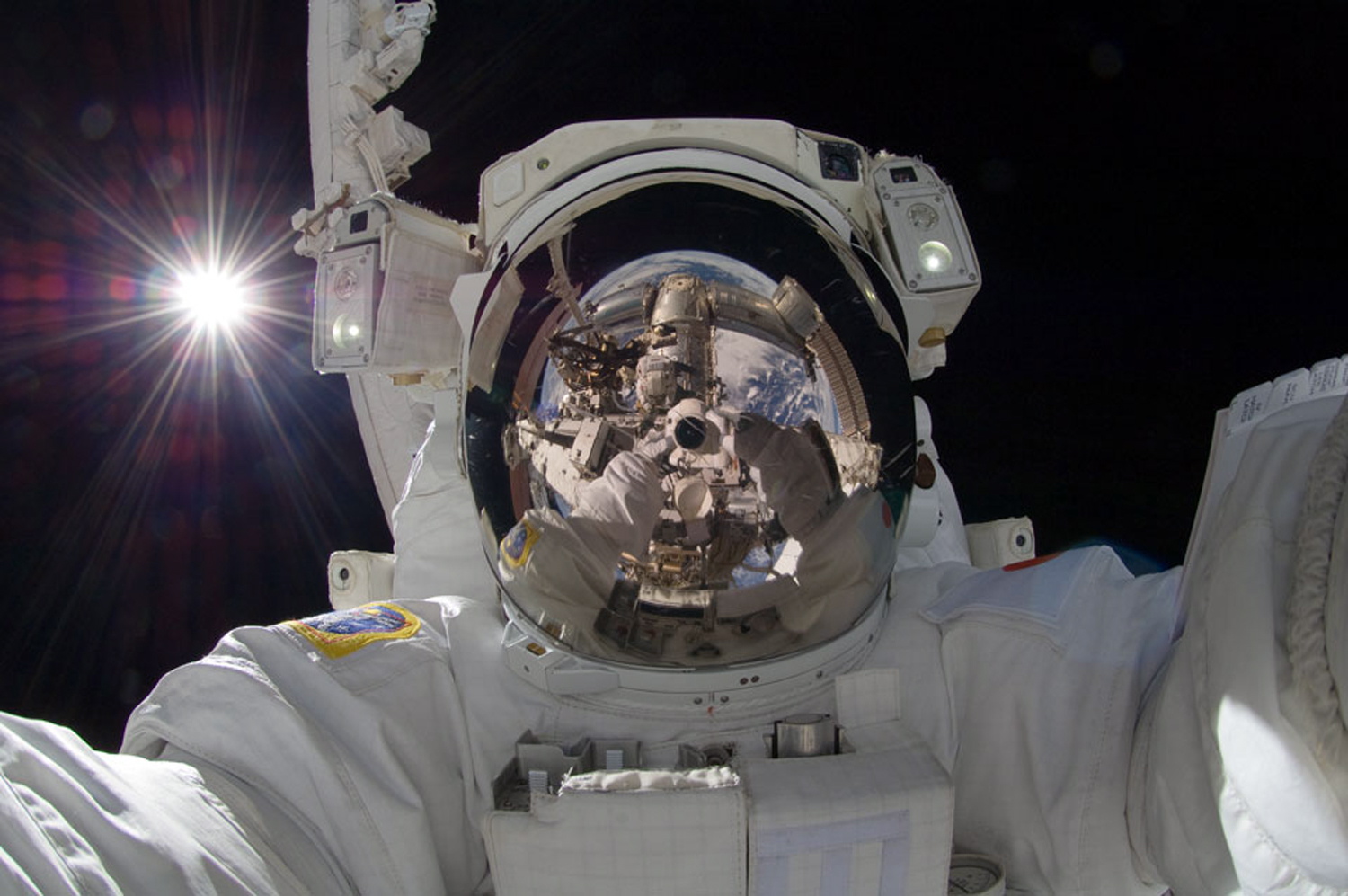 NASA
International space station astronaut Aki Hoshide takes a self-portrait Sept. 18,while in space. The practice of freezing and sharing our tiniest slices of life in &quot;selfies&quot; has become so popular that the granddaddy of dictionaries, the Oxford, is monitoring the term as a possible addition.