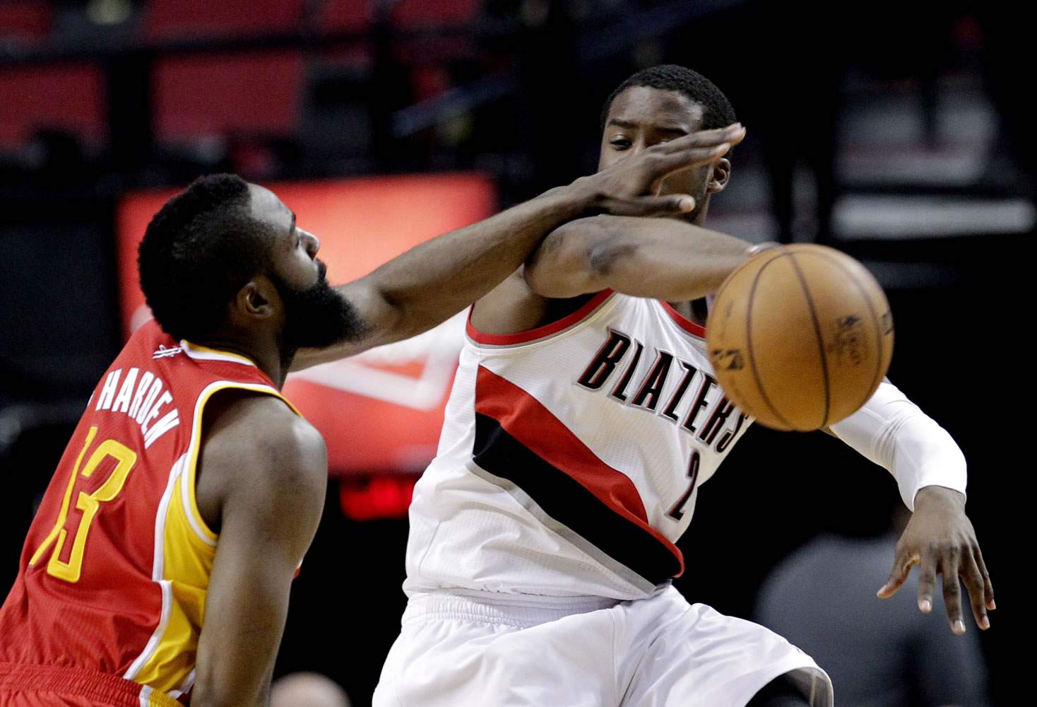 Houston Rockets guard James Harden, left, plays tight defense on Portland Trail Blazers guard Wesley Matthews during the first quarter Friday.