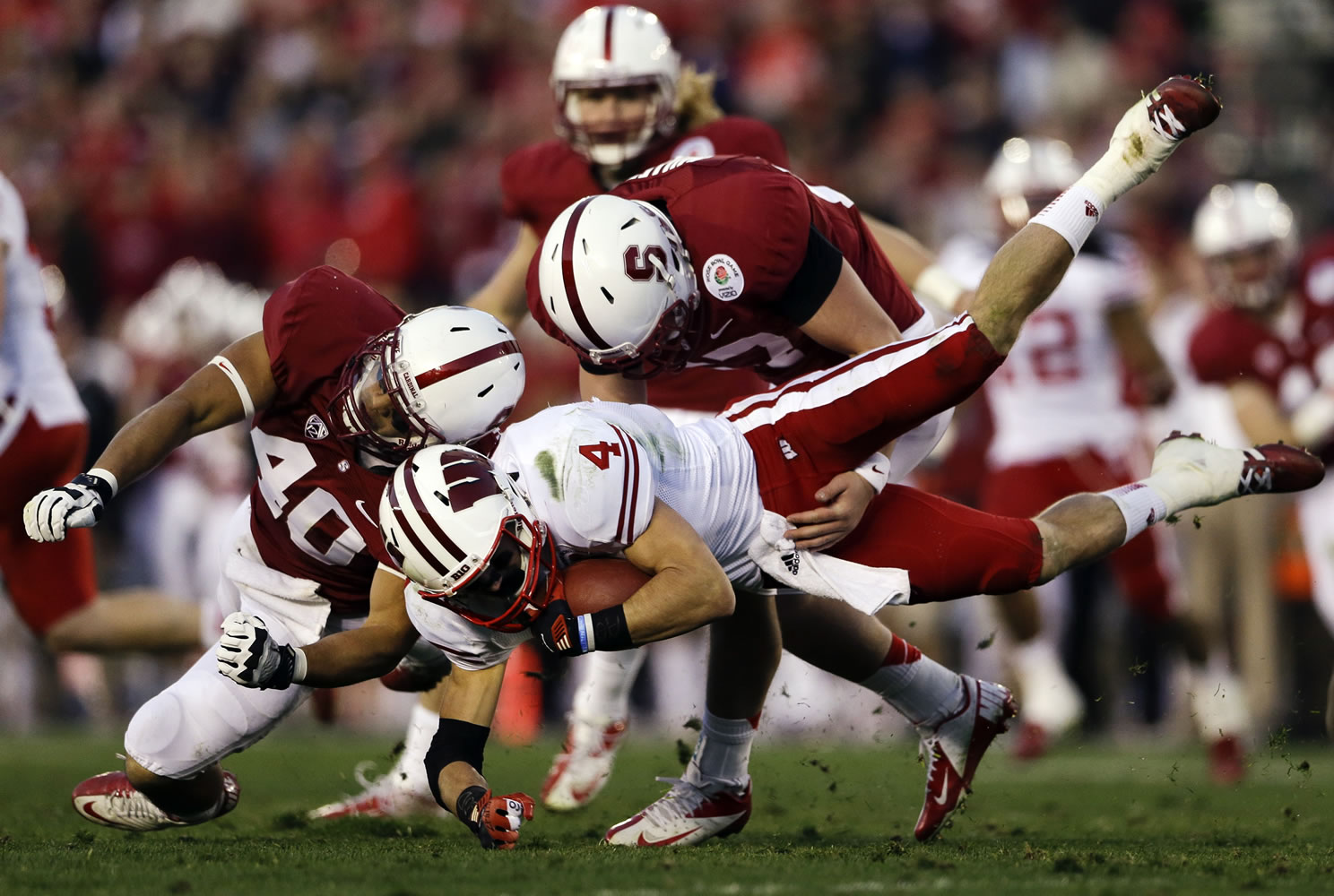 Wisconsin wide receiver Jared Abbrederis is hit by Stanford linebacker Joe Hemschoot (40) during the second half of the Rose Bowl on Tuesday.
