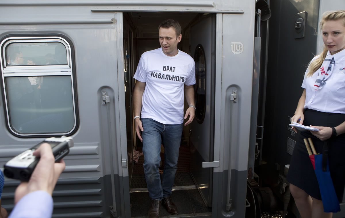 Russian opposition activist Alexei Navalny, wearing a T-shirt reading &quot;Navalny's Brother&quot; speaks to supporters and the media at the Yaroslavsky railway terminal before a departure to the city of Kirov where a court is set to announce a verdict in his case on Thursday in Moscow.