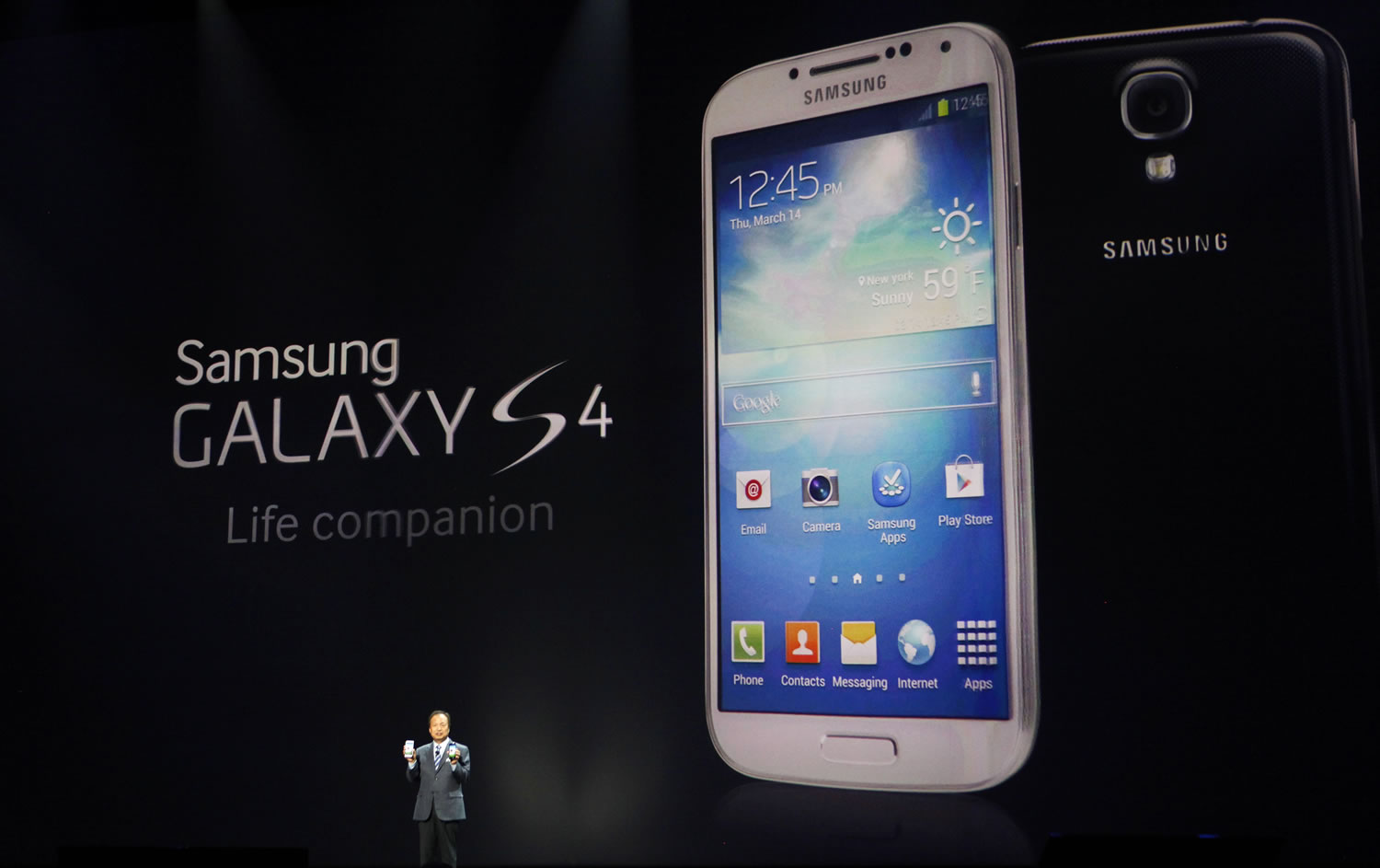 JK Shin, president and head of IT and Mobile Communications for Samsung Electronics, presents the new Samsung Galaxy S 4 during the Samsung Unpacked event at Radio City Music Hall on Thursday in New York.