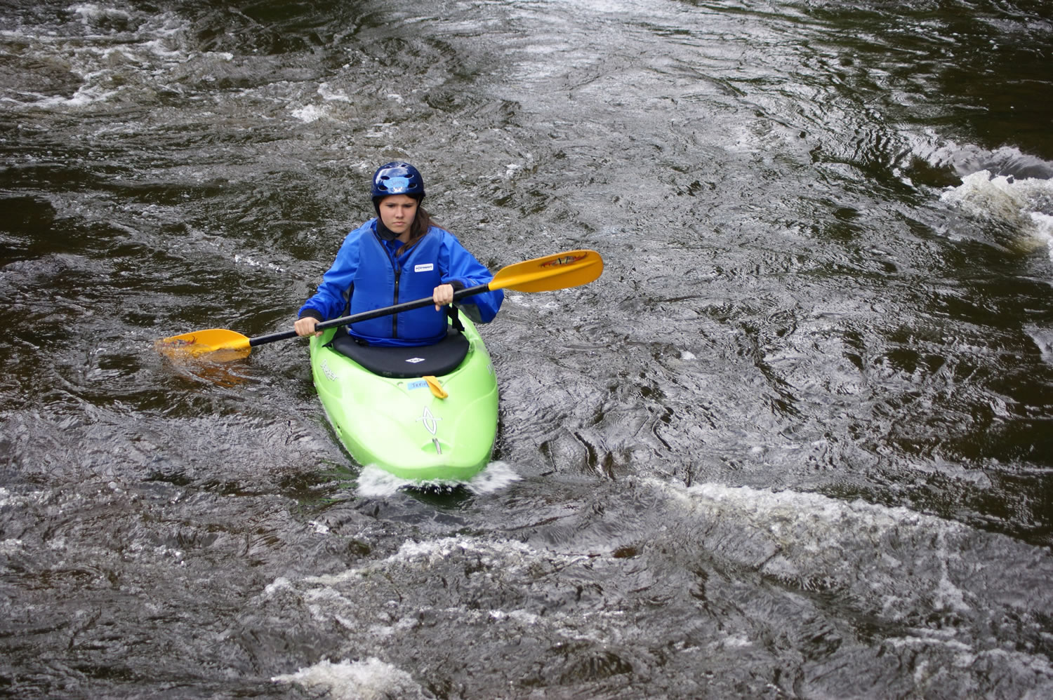 Boy Scouts Venturing crew member Jenny Welles kayaks on the Wolf River near White Lake, Wis.