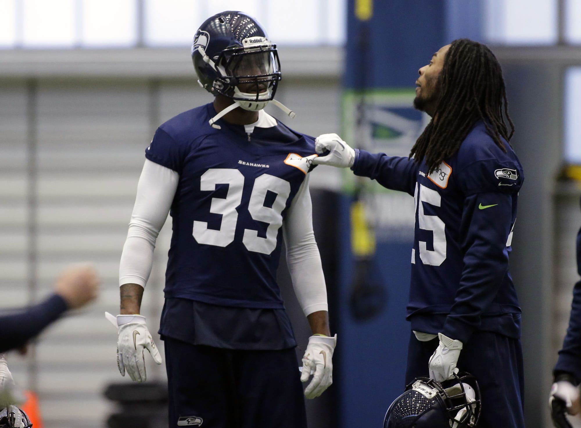 Seattle Seahawks cornerbacks Richard Sherman (25) and Brandon Browner (39) joke around during practice as they prepare to face the Falcons on Sunday.