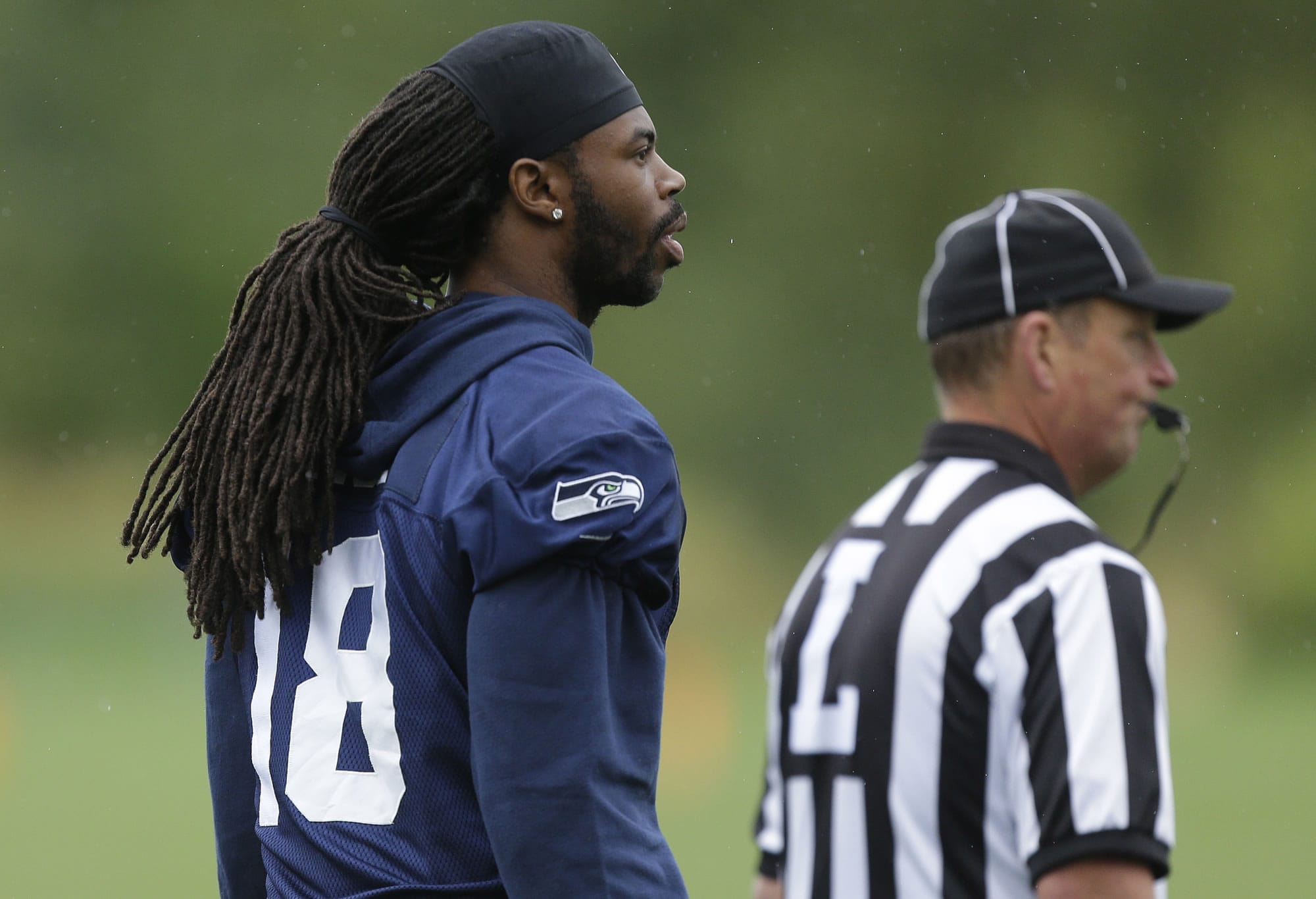 Wide receiver Sidney Rice returned to Seahawks camp Friday after receiving treatment on his sore knee in Switzerland earlier this week.
