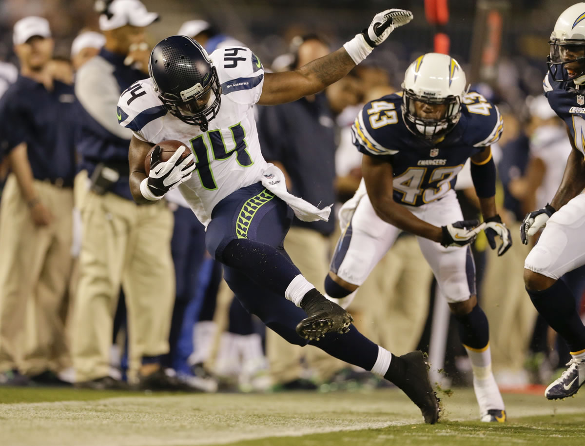 Seattle Seahawks running back Spencer Ware is pushed out of bounds by San Diego Chargers defensive back Greg Brown after a 22 yard gain in the fourth quarter on Thursday.