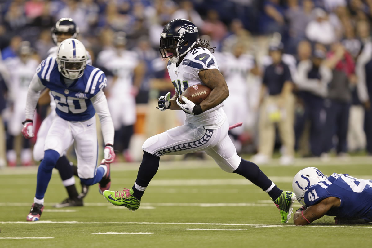 Seattle Seahawks running back Marshawn Lynch runs against the Indianapolis Colts during the first half Sunday.